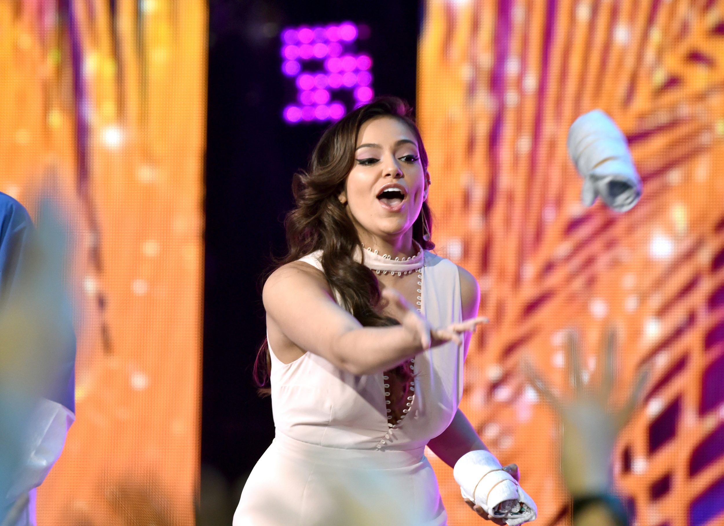 LOS ANGELES, CA - MARCH 11:  Internet personality Bethany Mota tosses a T-shirt onstage at Nickelodeon's 2017 Kids' Choice Awards at USC Galen Center on March 11, 2017 in Los Angeles, California.  (Photo by Frazer Harrison/KCA2017/Getty Images for Nickelodeon - Issued to Media by Nickelodeon)